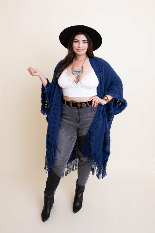 Navy open work frayed bohemian ruana by Periwinkle Aether, lightweight accessories with intricate woven pattern and fringe details.
