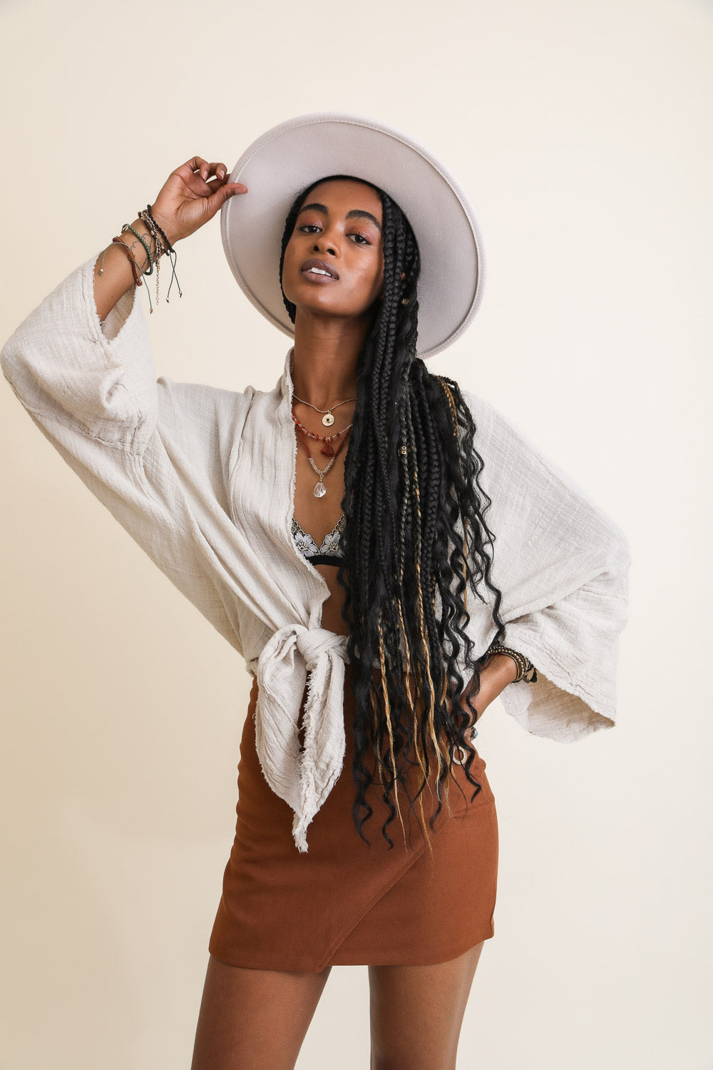 Periwinkle Aether flounce tie-front kimono wrap accessory with ruffled edges and lightweight fabric, styled as a fashionable cover-up.