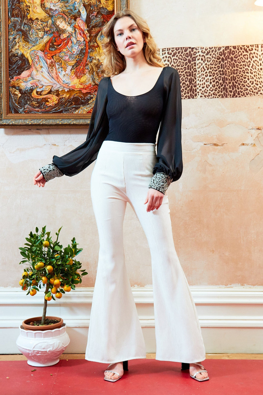 Black mesh bodysuit by Blush Athena, styled with Yasmine top and Callie trousers, featuring a fitted, see-through design.