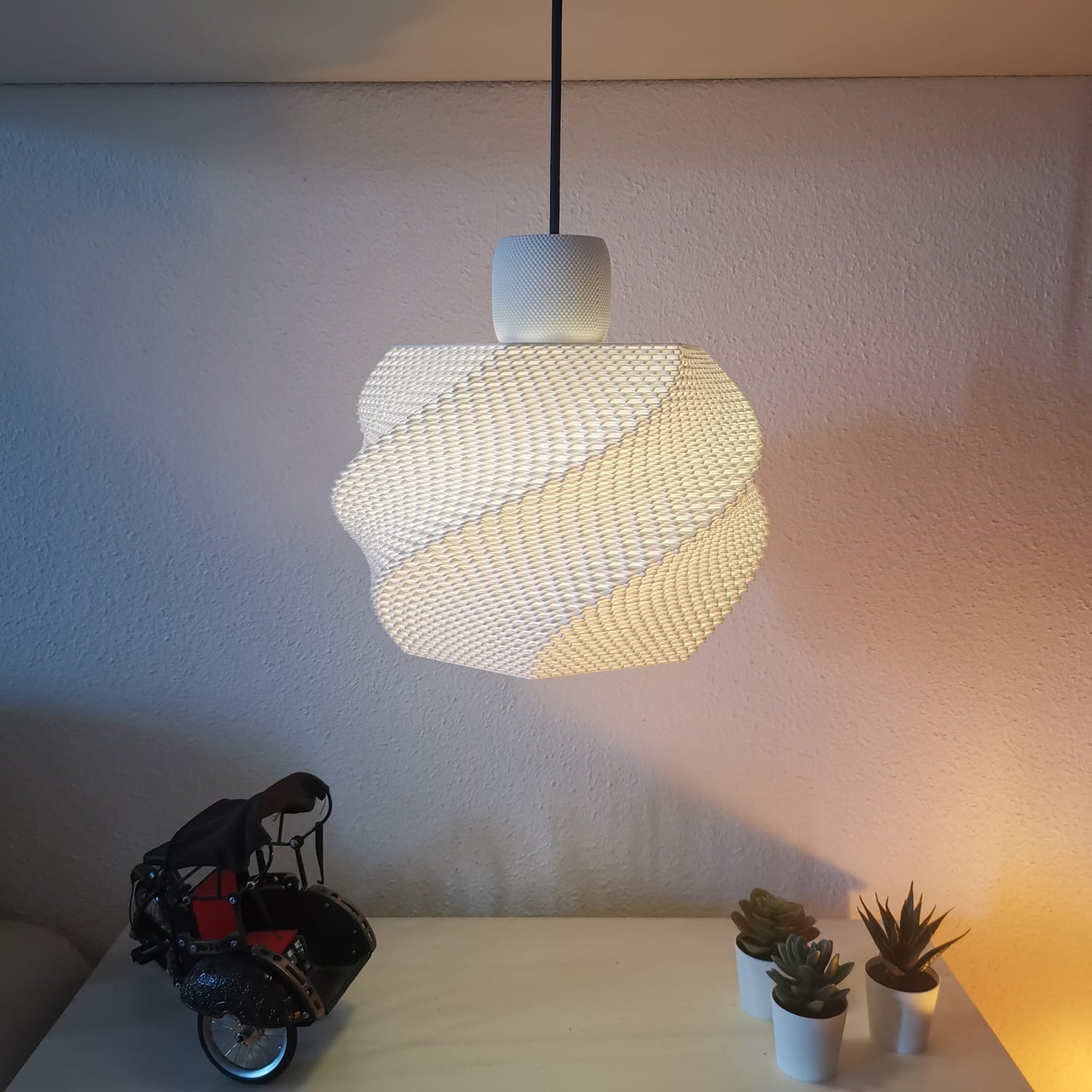 Azure Pontus Zenith Glow Pendant Lamp hanging with a sleek design and warm lighting for modern interior decor.