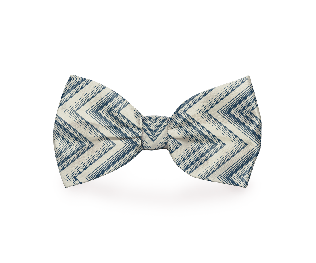 Indigo and beige zigzag dog bow tie by Plum Semele, styled on a pet collar for a fashionable pet accessory.