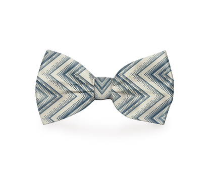 Indigo and beige zigzag dog bow tie by Plum Semele, styled on a pet collar for a fashionable pet accessory.