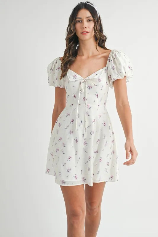 Pear Daisy floral print puff sleeve mini dress with a feminine design, featuring vibrant floral patterns and a stylish silhouette.