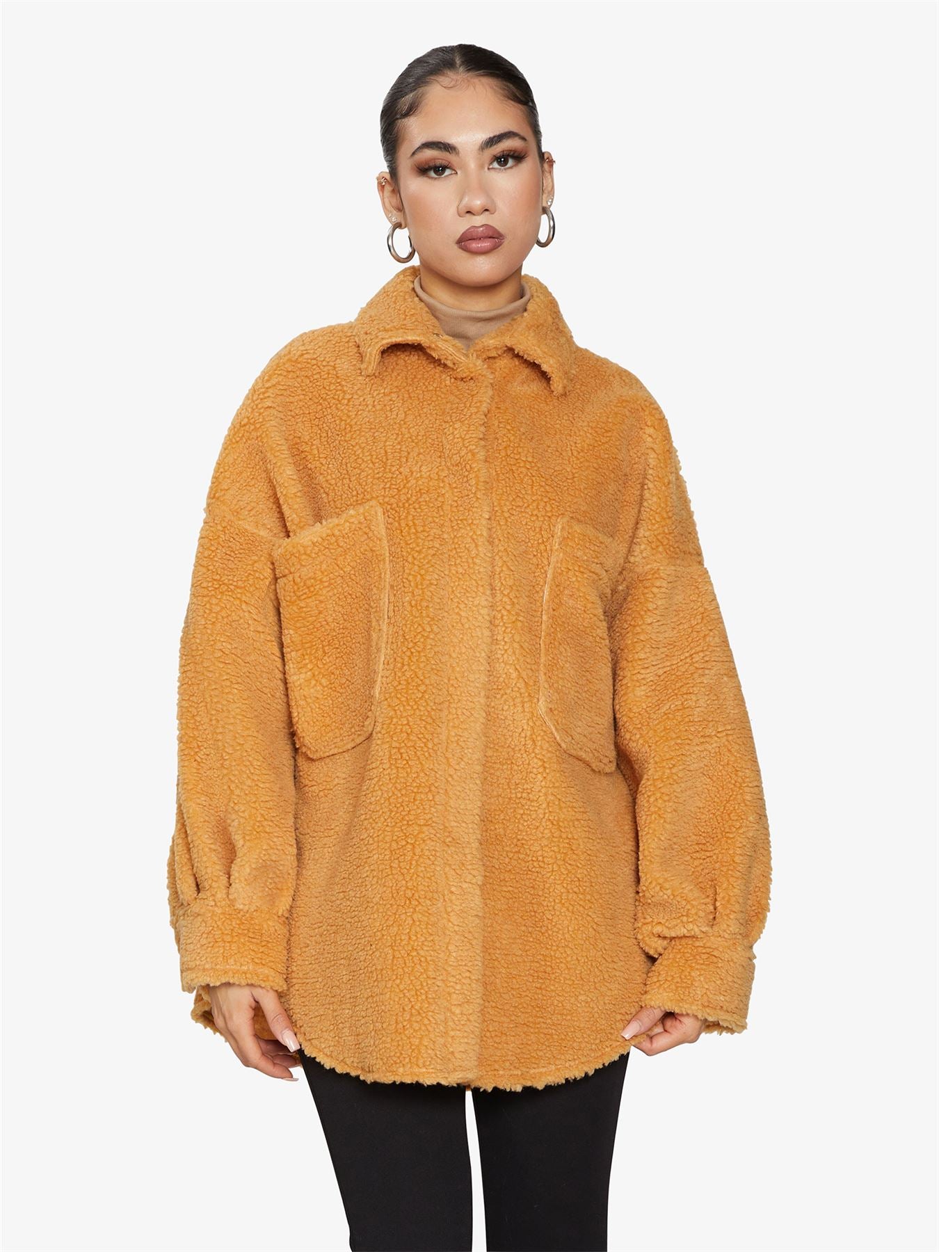 Rose Eleusis oversized patch pocket borg teddy shacket showing a cozy, plush exterior with large patch pockets and a relaxed fit.