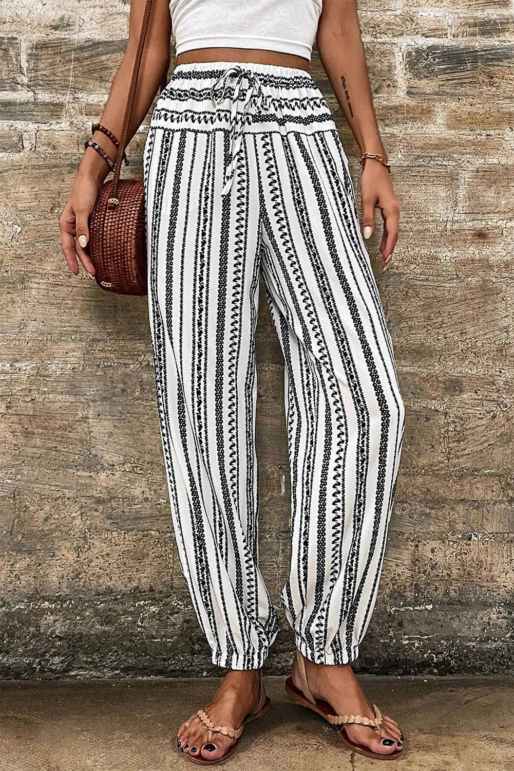 Black and white striped boho casual pants by Carmine Juneberry, featuring a relaxed fit and stylish striped print.