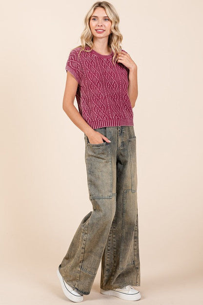 Jade Icarus Mittoshop washed wide-leg jeans with pockets, featuring a relaxed fit and denim texture.