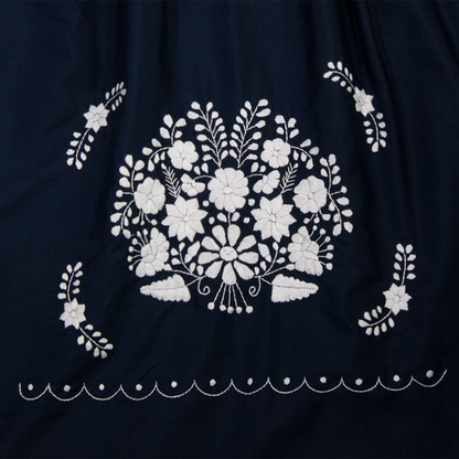 Navy blue Boho chic dress with white floral patterns for women, designed by Violet Athena, featuring a flowing, stylish silhouette.