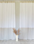 White and natural light linen curtains with tab tops in two tones, stylish home decor by Magenta Sugarplum.