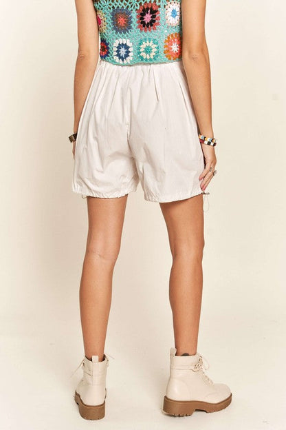 Jade Icarus ADORA drawstring shorts with pockets, showcasing a casual automotive-inspired design, in a relaxed fit.