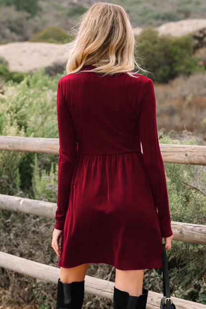 Ribbed knit patchwork long sleeve dress by Byzantium Bay featuring a fitted silhouette and textured fabric in natural tones.