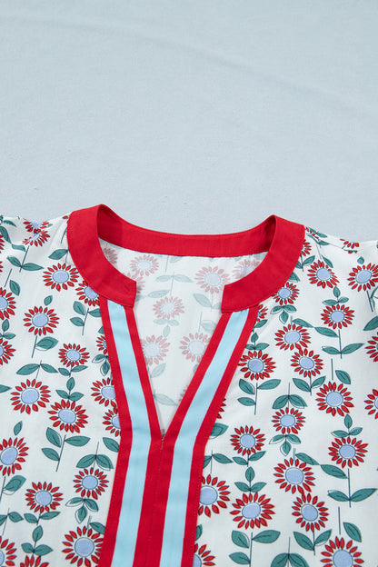 Floral contrast trim V-neck flutter sleeve blouse from Byzantium Bay, featuring a feminine design and lightweight fabric.