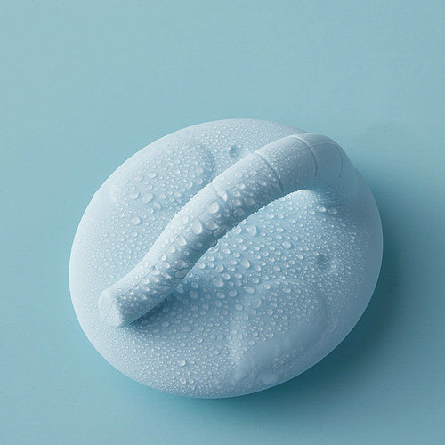 Maroon Asteria baby shower silicone brush for bathing, designed to gently remove dandruff during hair washing.
