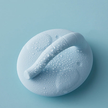 Maroon Asteria baby shower silicone brush for bathing, designed to gently remove dandruff from a baby&
