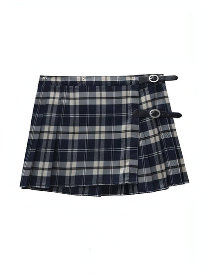 Carmine Juneberry pleated skirt with flowing fabric and midi length, styled on a model showcasing its elegant design.