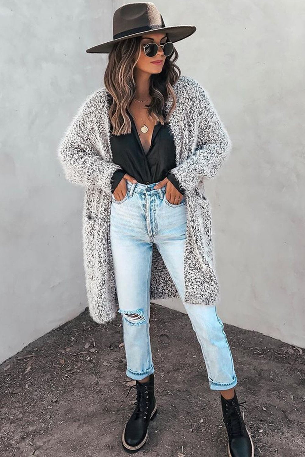 Cream fuzzy knit cardigan with pockets for women by Jade, shown draped on a hanger with a cozy, textured appearance.