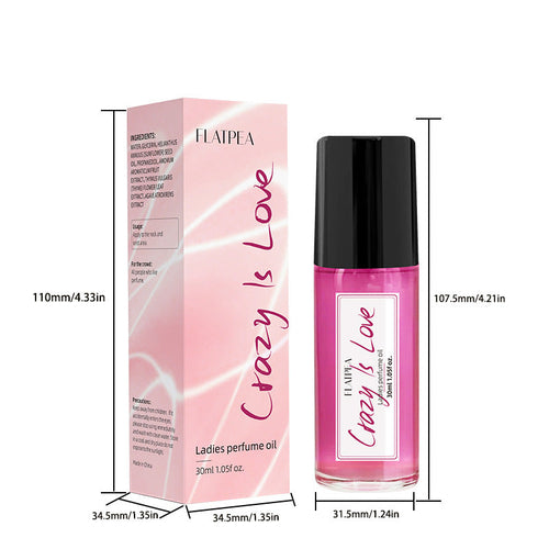 Carmine Juneberry Crazy In Love™ ball perfume oil for women, featuring a sleek bottle with a decorative cap and floral accents.