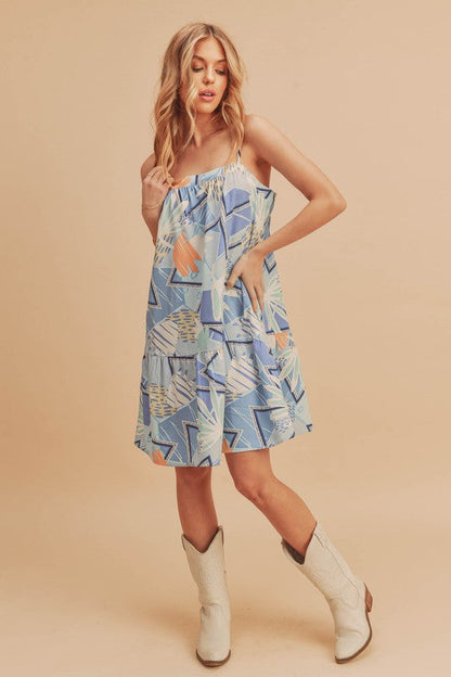 Jade Icarus Aemi + Co printed ruffled hem square neck mini cami dress for women, featuring a floral print and ruffled hem detail.