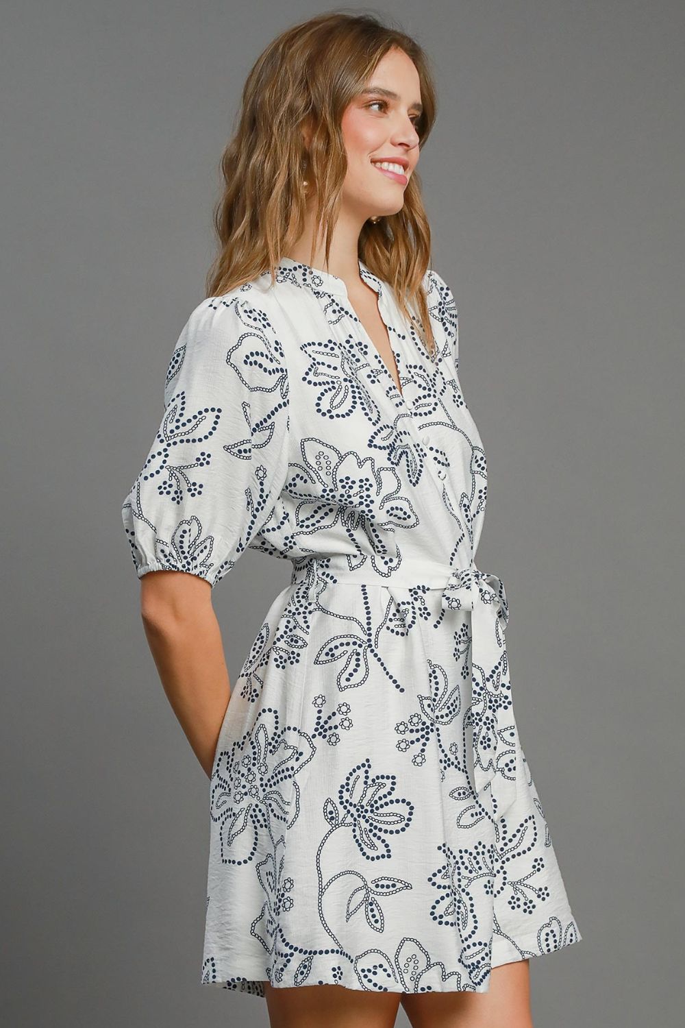 Automotive Jade Icarus full-size floral print notched puff sleeve mini dress, stylish plus size fashion, displayed on a model.