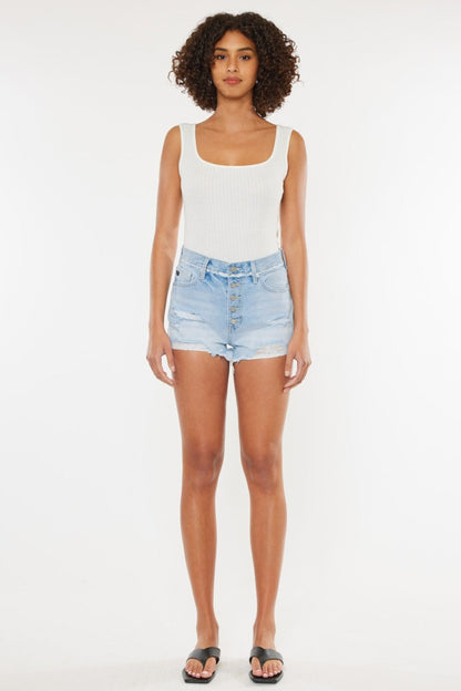 Jade Icarus distressed button fly denim shorts with frayed edges and worn details, styled for casual summer wear.