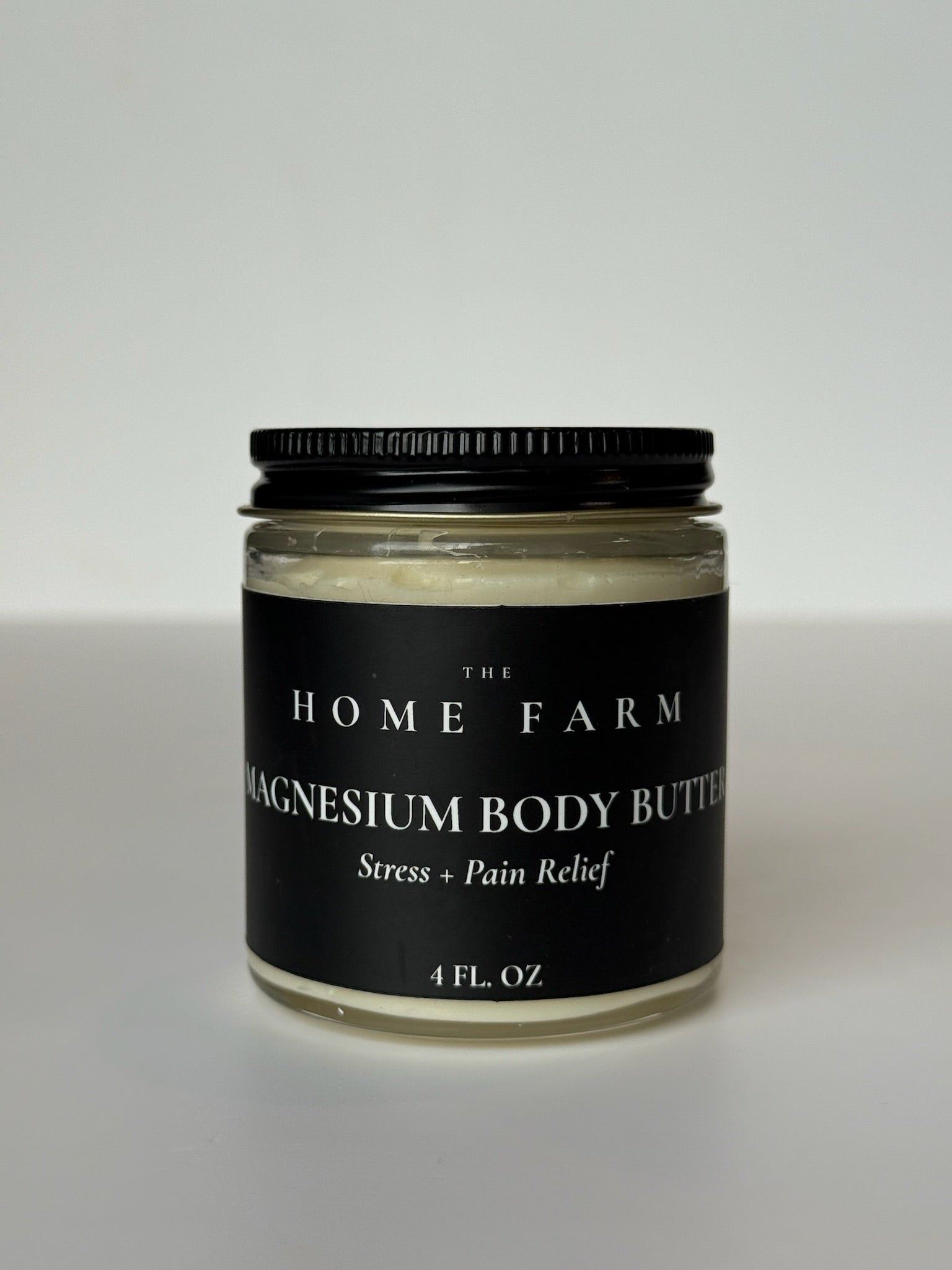 DC-The Home Farm Magnesium Body Butter for skin hydration and relaxation, shown in a natural skincare jar with smooth texture.