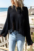 Black distressed boxy fit crop knit sweater by Harlequin Daisy, showcasing its textured, relaxed style and distressed details.