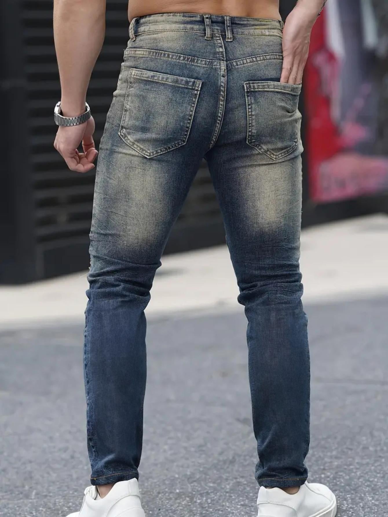 Men’s navy ripped stretch jeans by Carmine Juneberry featuring a high street urban style with distressed details.