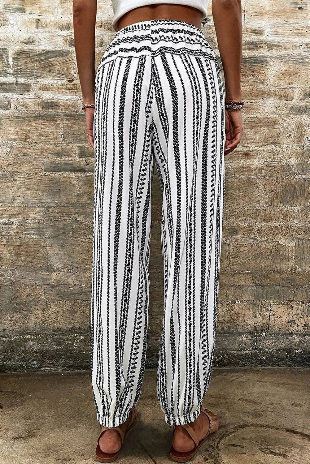 Carmine Juneberry black and white stripe boho casual pants with striped print and relaxed fit.