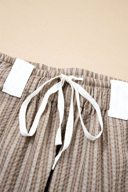 Byzantium Bay Stripe drawstring cargo jogger pants with multiple pockets and relaxed fit, suitable for casual wear.