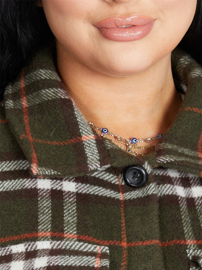 Oversized Nova Check wool blend shacket by Rose Eleusis featuring a bold check pattern and relaxed fit, ideal for layered fall looks.