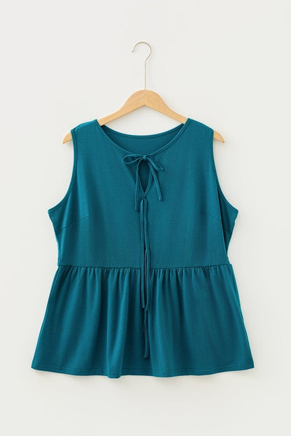 Plus size solid bow-tie peplum tank top for women by Byzantium Bay, featuring a stylish bow detail and flattering peplum fit.
