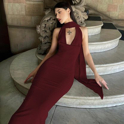 Green Alcestis skincare product, slim backless halter neck dress image showcasing elegant design and stylish details.