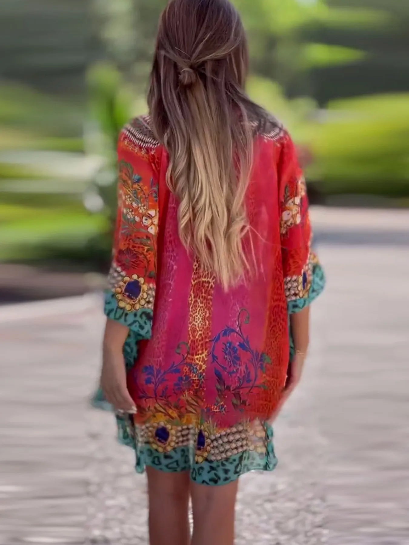 Floral print V-neck cover up by Carmine Juneberry, lightweight fabric with colorful flower patterns, perfect for beach or poolside.