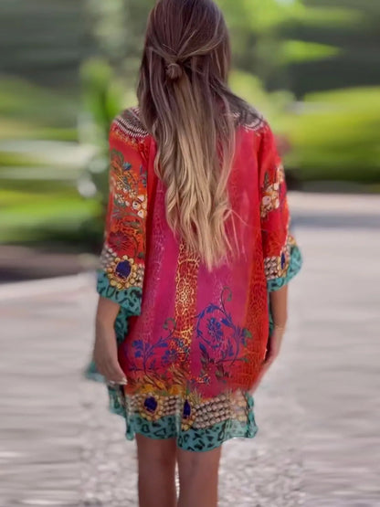 Floral print V-neck cover up by Carmine Juneberry, lightweight fabric with colorful flower patterns, perfect for beach or poolside.
