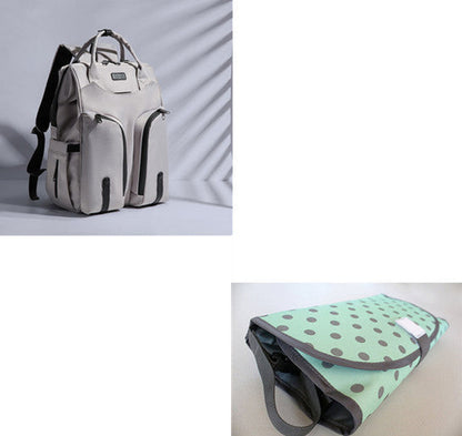 Carmine Juneberry SmartMom Travel+ Diaper Backpack with multiple compartments and adjustable straps, designed for parents on the go.