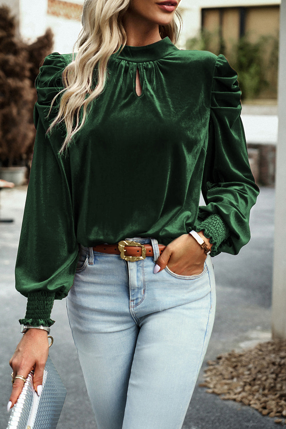 Blackish green velvet puff sleeve mock neck blouse by Carmine Juneberry, styled as a fashionable women&