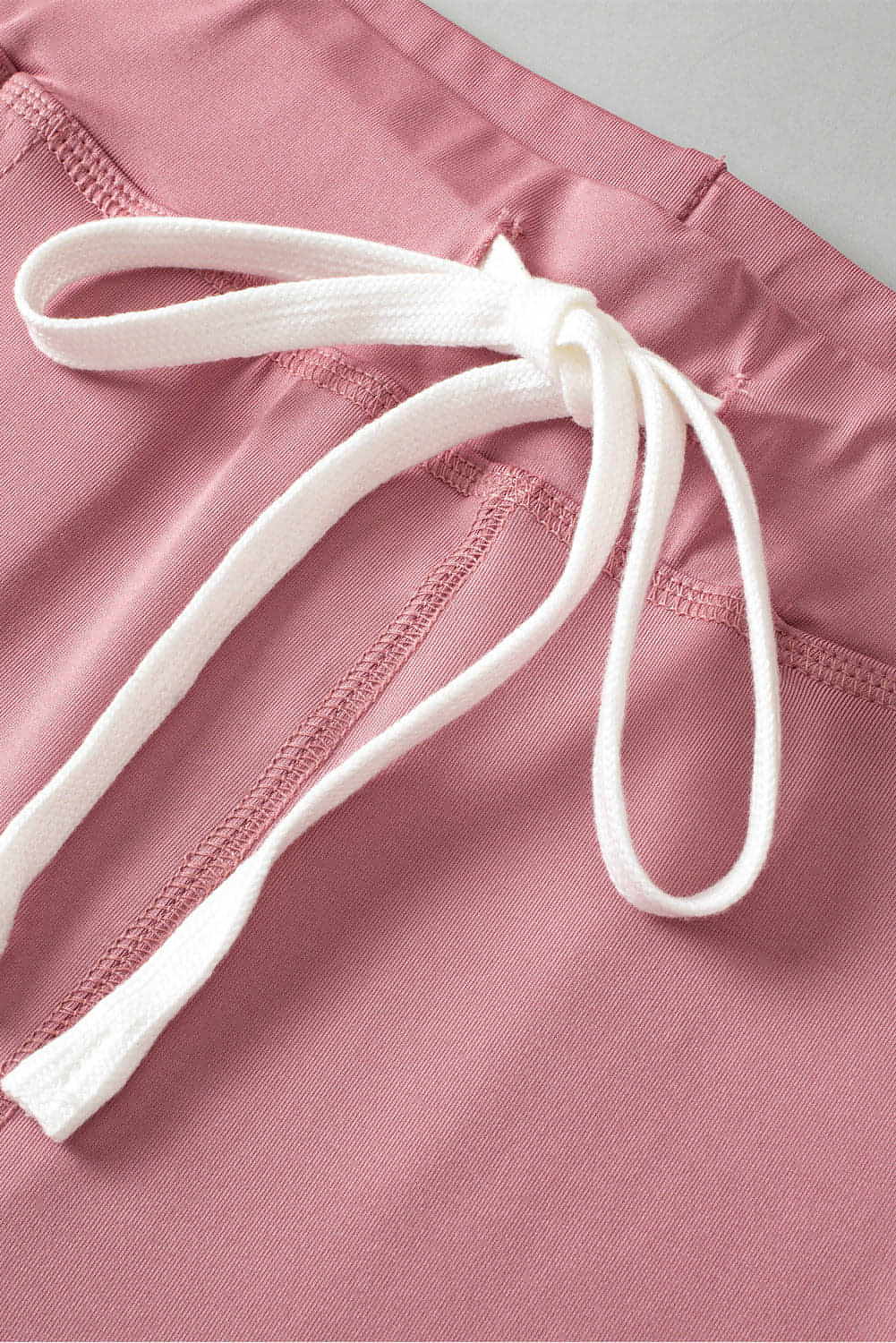 Pink drawstring waist joggers with pockets from Carmine Juneberry activewear, designed for comfort and casual wear.