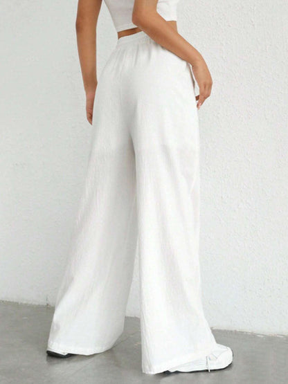 Carmine Juneberry drawstring wide leg pants in soft fabric with a relaxed fit and high waist, shown on a model.