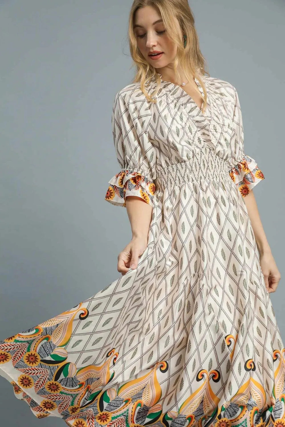 Pear Daisy Umgee printed smocked waist flounce sleeve midi dress, showing the flowy floral design and stylish silhouette.