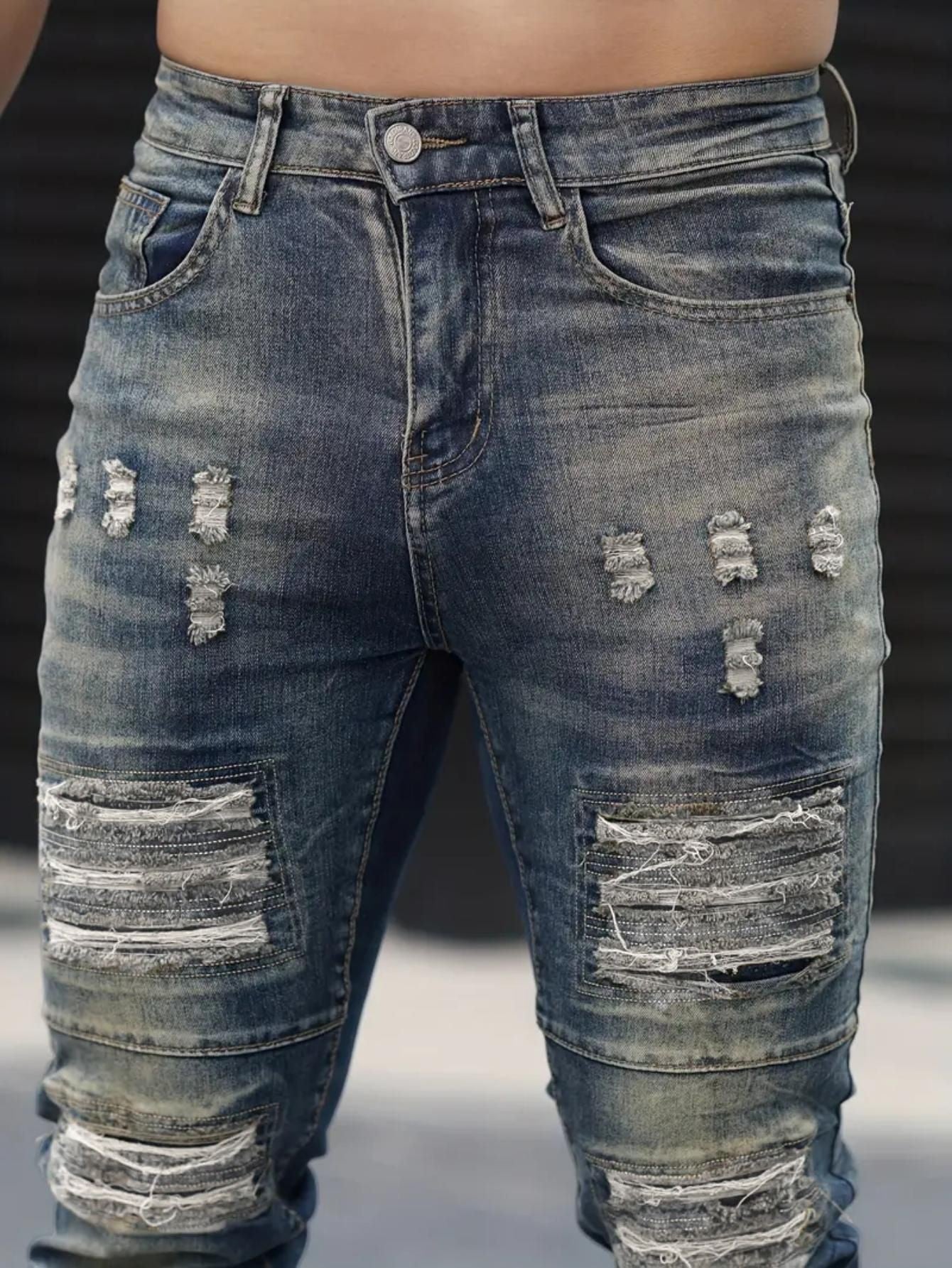 Men’s navy ripped stretch jeans by Carmine Juneberry, featuring distressed details and a slim fit, perfect for urban casual style.