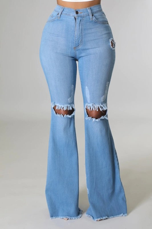 Medium wash Jade Icarus knee rip flare jeans with 32-inch inseam, featuring distressed detailing and stylish flare leg.