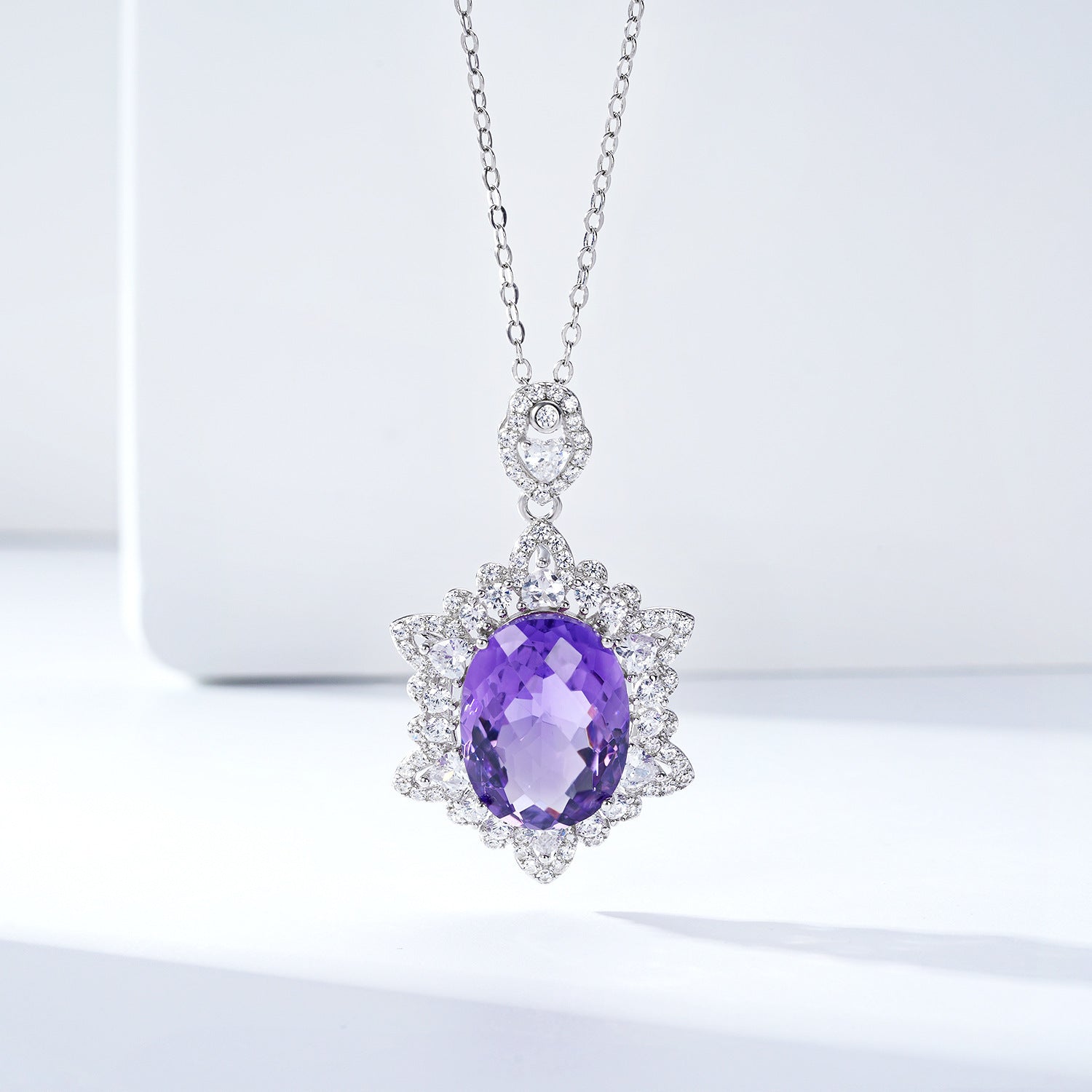Carmine Juneberry LuxeJewels Amélys Clarity Pendant necklace with sparkling gemstone on a delicate chain.