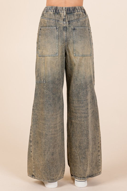 Jade Icarus Mittoshop washed wide-leg jeans with pockets, showcasing relaxed fit and casual denim style.