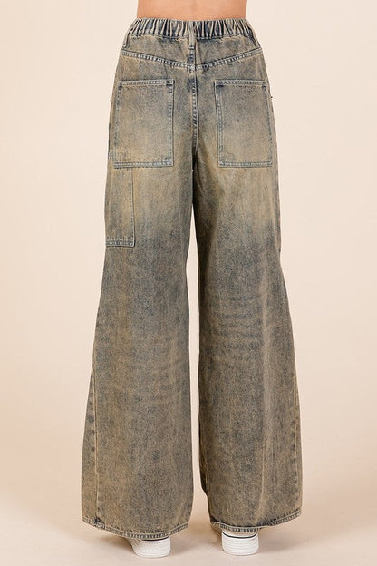 Jade Icarus Mittoshop washed wide-leg jeans with pockets, showcasing relaxed fit and casual denim style.
