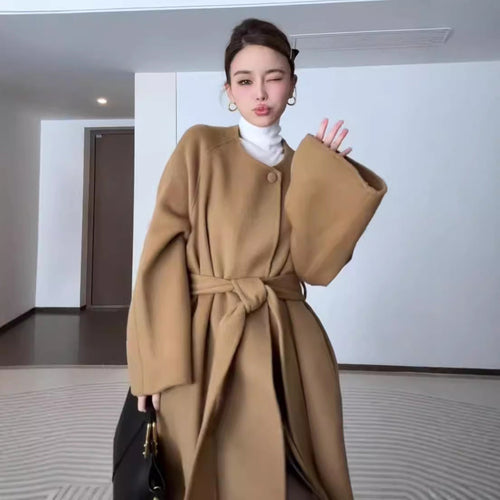 Women’s reversible cashmere coat by Carmine Juneberry, showcasing elegant winter style with plush fabric and versatile design.
