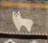 Gray alpaca watching socks by Milky Way, cozy knit socks featuring an alpaca design on soft fabric.