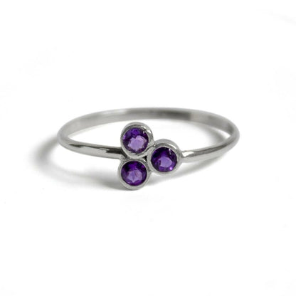 Sterling silver ring featuring a large purple amethyst cluster, crafted by Grey Clymene, showcasing elegant jewelry design.