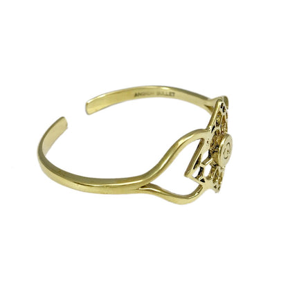 Ariel Angkor Bullet Cuff bracelet featuring intricate design inspired by Cambodian art, made of metal with detailed patterns.