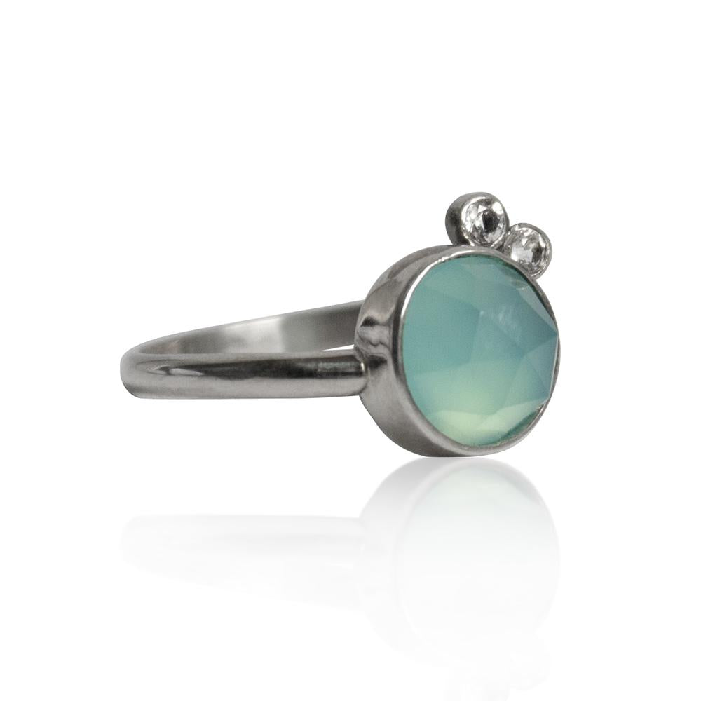 Sterling silver ring with aqua chalcedony and white topaz gemstones, showcasing a elegant jewelry design.