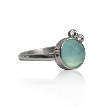 Sterling silver ring with aqua chalcedony and white topaz gemstones, showcasing a elegant jewelry design.