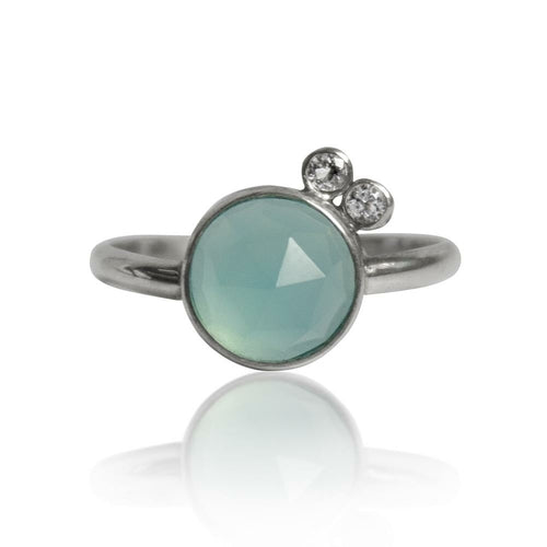 Sterling silver ring featuring aqua chalcedony and white topaz gemstones, showcasing elegant jewelry design.